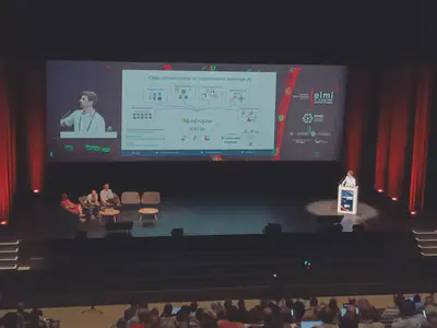Nils presenting the BioEngine 'open infrastructure for collaborative bioimage AI' overview to a packed ELMI hall.